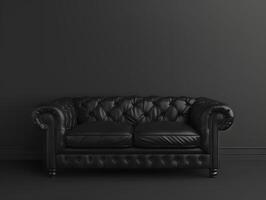 Black chic soft comfortable sofa on a black plain background photo