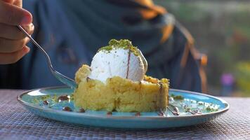 Enjoy a delectable dessert featuring ice cream in a warm and inviting atmosphere video