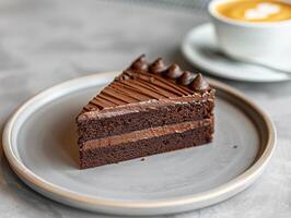 Chocolate cake slice on a plate photo