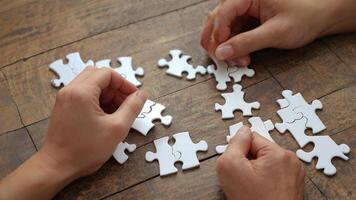 Hands holding puzzle business problem solving concept photo
