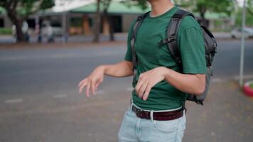 A hiker is shaking because he has too much strain on his wrists while holding a heavy object. video