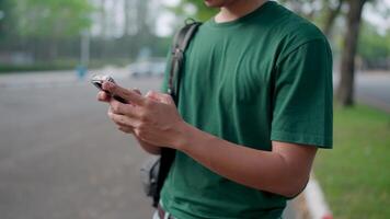 Close-up of a man using his phone to talk about work via an app. video