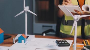Selective focus, Asian female architect or engineer Currently considering materials for designing modern condominiums. Asian female architect or engineer Sit and analyze, design projects in the office video