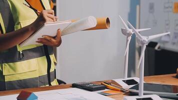 Selective focus, Asian female architect or engineer Currently considering materials for designing modern condominiums. Asian female architect or engineer Sit and analyze, design projects in the office video