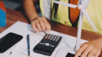 Selective focus, Asian female architect or engineer Currently considering materials for designing modern condominiums. Asian female architect or engineer Sit and analyze, design projects in the office video