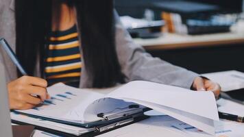 Office colleagues have a casual discussion. During a meeting in a conference room, a group of business teem sit in the conference room new startup project video