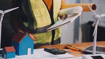 Selective focus, Asian female architect or engineer Currently considering materials for designing modern condominiums. Asian female architect or engineer Sit and analyze, design projects in the office video