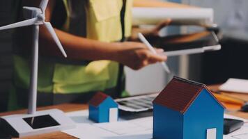 Selective focus, Asian female architect or engineer Currently considering materials for designing modern condominiums. Asian female architect or engineer Sit and analyze, design projects in the office video