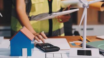 Selective focus, Asian female architect or engineer Currently considering materials for designing modern condominiums. Asian female architect or engineer Sit and analyze, design projects in the office video