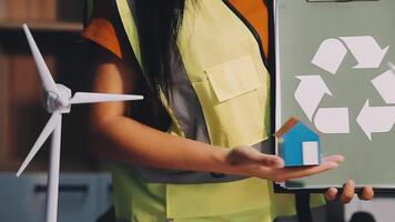 Selective focus, Asian female architect or engineer Currently considering materials for designing modern condominiums. Asian female architect or engineer Sit and analyze, design projects in the office video