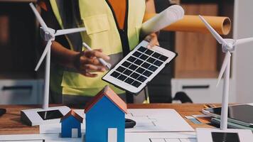 Selective focus, Asian female architect or engineer Currently considering materials for designing modern condominiums. Asian female architect or engineer Sit and analyze, design projects in the office video