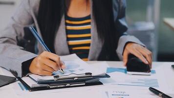 Office colleagues have a casual discussion. During a meeting in a conference room, a group of business teem sit in the conference room new startup project video