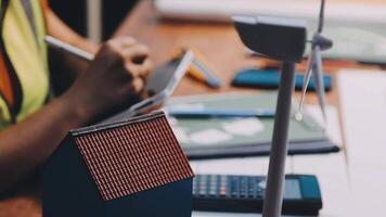 Selective focus, Asian female architect or engineer Currently considering materials for designing modern condominiums. Asian female architect or engineer Sit and analyze, design projects in the office video
