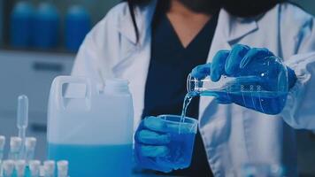 Scientists analyzing coronavirus study data and evaluating microscope. Health care researchers doing some research virus with dropper chemical testing and working in life science laboratory. video