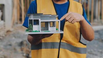 Construction worker, tablet and portrait of man with research and digital data for solar panel installation. Happy, engineer and male contractor with eco and energy project with tech and online plan video