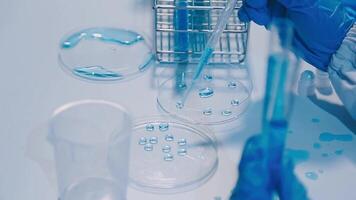 Scientists analyzing coronavirus study data and evaluating microscope. Health care researchers doing some research virus with dropper chemical testing and working in life science laboratory. video