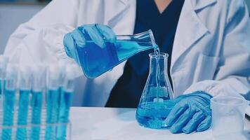 Scientists analyzing coronavirus study data and evaluating microscope. Health care researchers doing some research virus with dropper chemical testing and working in life science laboratory. video