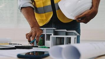 architect man working with laptop and blueprints,engineer inspection in workplace for architectural plan,sketching a construction project ,selective focus,Business concept vintage color video