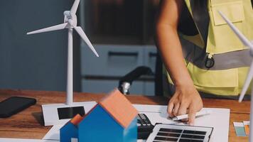 Selective focus, Asian female architect or engineer Currently considering materials for designing modern condominiums. Asian female architect or engineer Sit and analyze, design projects in the office video