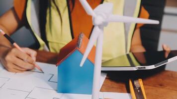 Selective focus, Asian female architect or engineer Currently considering materials for designing modern condominiums. Asian female architect or engineer Sit and analyze, design projects in the office video