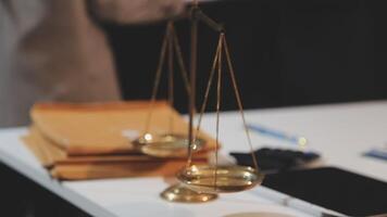 justice and law concept. asian woman lawyer working and judge in a courtroom the gavel, working with tablet and laptop and digital tablet computer on white table video