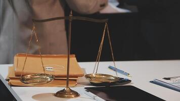 justice and law concept. asian woman lawyer working and judge in a courtroom the gavel, working with tablet and laptop and digital tablet computer on white table video