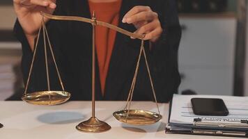 justice and law concept. asian woman lawyer working and judge in a courtroom the gavel, working with tablet and laptop and digital tablet computer on white table video