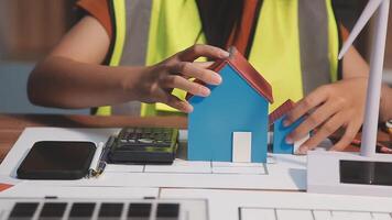 Selective focus, Asian female architect or engineer Drawing the design of the building's interior using a tablet. Asian female architect or engineer Sit and analyze, design projects in the office. video