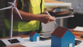 Selective focus, Asian female architect or engineer Drawing the design of the building's interior using a tablet. Asian female architect or engineer Sit and analyze, design projects in the office. video