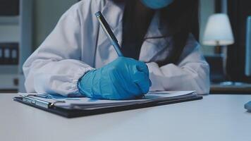 chemist,scientist hand dropping chemical liquid into test tube, science research and development concept video