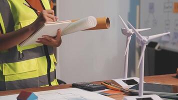 Selective focus, Asian female architect or engineer Drawing the design of the building's interior using a tablet. Asian female architect or engineer Sit and analyze, design projects in the office. video