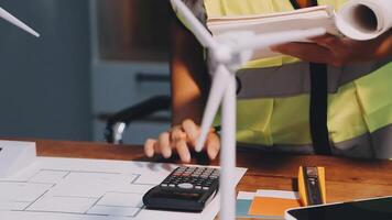 Selective focus, Asian female architect or engineer Currently considering materials for designing modern condominiums. Asian female architect or engineer Sit and analyze, design projects in the office video