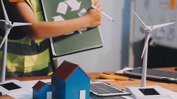Selective focus, Asian female architect or engineer Currently considering materials for designing modern condominiums. Asian female architect or engineer Sit and analyze, design projects in the office video