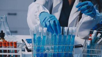 Scientists analyzing coronavirus study data and evaluating microscope. Health care researchers doing some research virus with dropper chemical testing and working in life science laboratory. video
