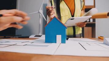 Selective focus, Asian female architect or engineer Currently considering materials for designing modern condominiums. Asian female architect or engineer Sit and analyze, design projects in the office video