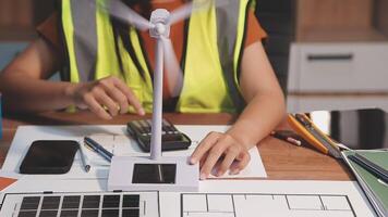 Selective focus, Asian female architect or engineer Drawing the design of the building's interior using a tablet. Asian female architect or engineer Sit and analyze, design projects in the office. video