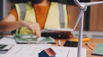 Selective focus, Asian female architect or engineer Currently considering materials for designing modern condominiums. Asian female architect or engineer Sit and analyze, design projects in the office video