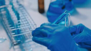 Scientists analyzing coronavirus study data and evaluating microscope. Health care researchers doing some research virus with dropper chemical testing and working in life science laboratory. video