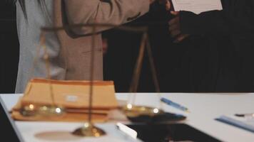 justice and law concept. asian woman lawyer working and judge in a courtroom the gavel, working with tablet and laptop and digital tablet computer on white table video