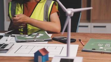 Selective focus, Asian female architect or engineer Drawing the design of the building's interior using a tablet. Asian female architect or engineer Sit and analyze, design projects in the office. video