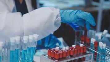 chemist,scientist hand dropping chemical liquid into test tube, science research and development concept video