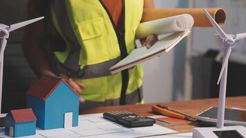 Selective focus, Asian female architect or engineer Drawing the design of the building's interior using a tablet. Asian female architect or engineer Sit and analyze, design projects in the office. video