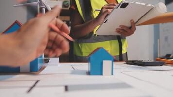 Selective focus, Asian female architect or engineer Drawing the design of the building's interior using a tablet. Asian female architect or engineer Sit and analyze, design projects in the office. video