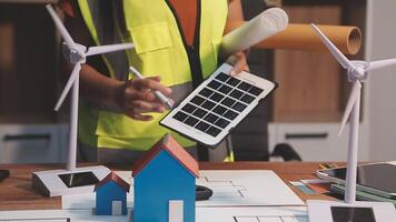Selective focus, Asian female architect or engineer Drawing the design of the building's interior using a tablet. Asian female architect or engineer Sit and analyze, design projects in the office. video