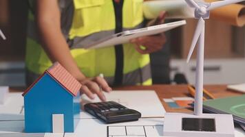Selective focus, Asian female architect or engineer Drawing the design of the building's interior using a tablet. Asian female architect or engineer Sit and analyze, design projects in the office. video
