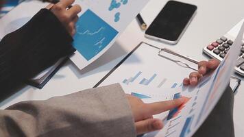 Finance manager meeting discussing company growth project success financial statistics, professional investor working start up project for strategy plan with document, laptop and digital tablet. video