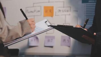 Finance manager meeting discussing company growth project success financial statistics, professional investor working start up project for strategy plan with document, laptop and digital tablet. video