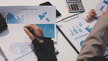 Finance manager meeting discussing company growth project success financial statistics, professional investor working start up project for strategy plan with document, laptop and digital tablet. video