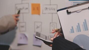Finance manager meeting discussing company growth project success financial statistics, professional investor working start up project for strategy plan with document, laptop and digital tablet. video