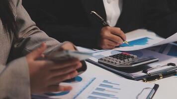 Finance manager meeting discussing company growth project success financial statistics, professional investor working start up project for strategy plan with document, laptop and digital tablet. video